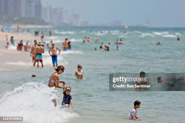 Beachgoers are shown on Fort Lauderdale Beach on July 14 in Florida.