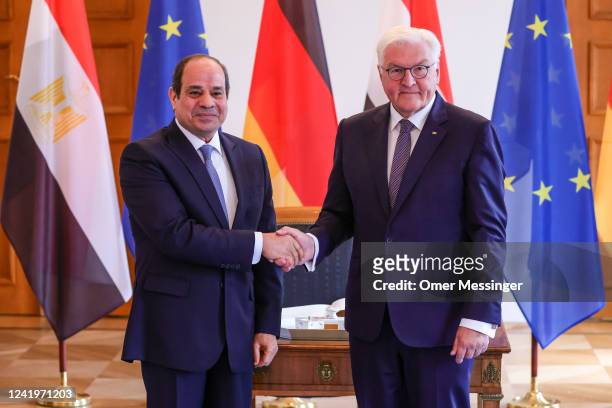 German President, Frank-Walter Steinmeier shake hands with Egyptian President Abdel Fattah al-Sisi at Bellevue Palace on July 18, 2022 in Berlin,...