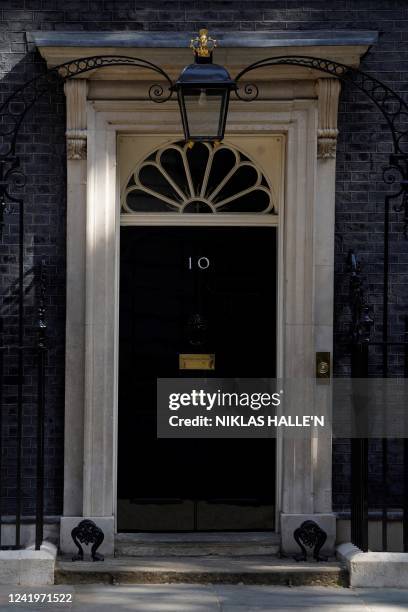 Photograph taken on July 18, 2022 shows the entrance door of 10 Downing Street, in central London. British Prime Minister Boris Johnson's government...