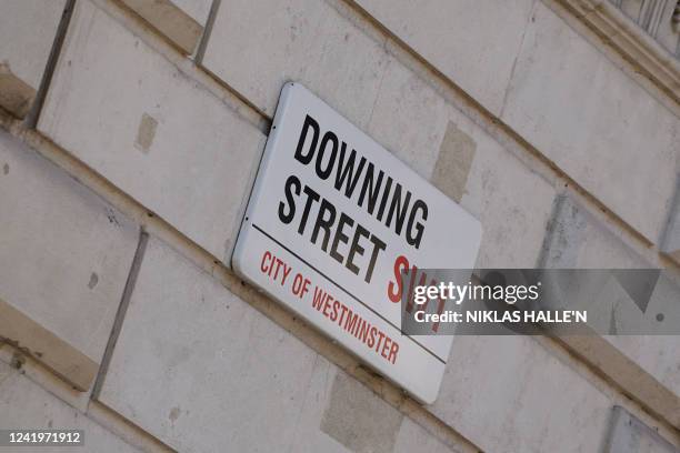 Photograph taken on July 18, 2022 shows the street sign for Downing Street, in central London. British Prime Minister Boris Johnson's government...