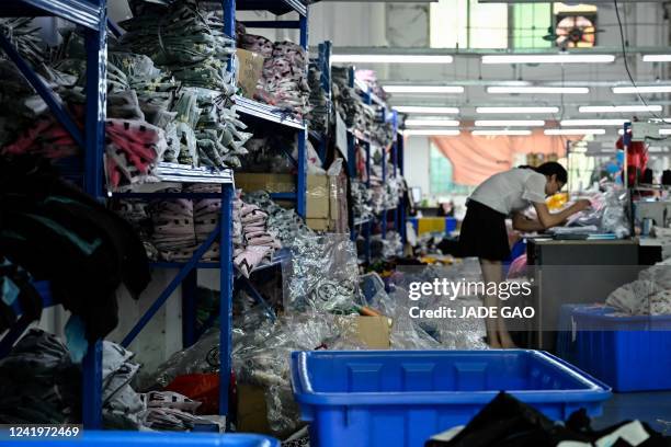Worker makes clothes at a garment factory that supplies SHEIN, a cross-border fast fashion e-commerce company in Guangzhou, in China's southern...