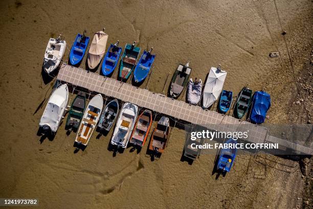 An aerial view shows boats in the dry bed of Brenets Lake , part of the Doubs River, a natural border between eastern France and western Switzerland,...