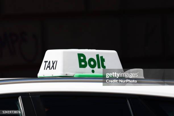 Bolt taxi sign is seen on a car in Krakow, Poland on July 18, 2022.