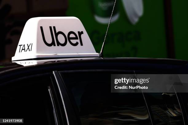 Uber taxi sign is seen on a car in Krakow, Poland on July 18, 2022.