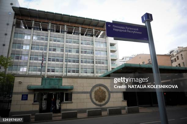 Street sign reading "Lugansk People's Republic Square" sits in front of the British embassy in Moscow on July 18 after the square along the...