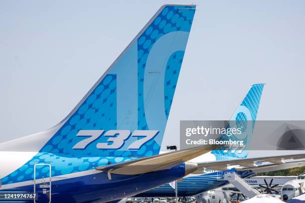 The tailfins of a Boeing 737 Max 10 and a Boeing 777-9 aircraft on the opening day of the Farnborough International Airshow in Farnborough, UK, on...