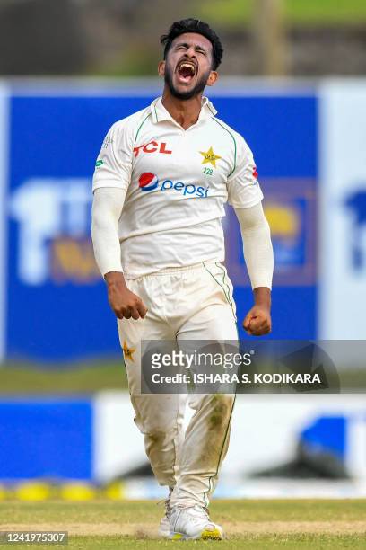 Pakistans Hasan Ali celebrates after taking the wicket of Sri Lanka's Maheesh Theekshana during the third day of play of the first cricket Test match...