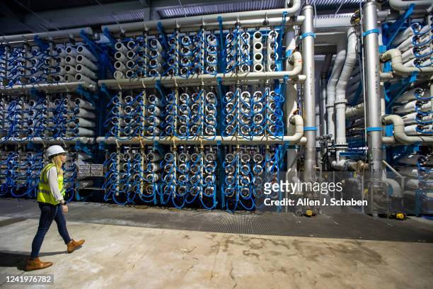 Carlsbad, CA Michelle Peters, technical and compliance manager for Poseidon Water, walks in the reverse osmosis building, which contains more than...