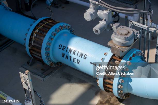 Carlsbad, CA A view of a water pipe in the post treatment section with includes adding minerals and disinfection with chlorine into the water at the...