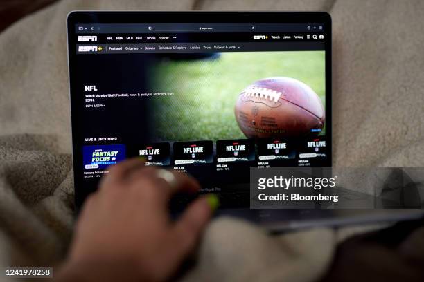 The ESPN+ NFL homescreen on a laptop computer in the Brooklyn borough of New York, US, on Monday, July 18, 2022. Walt Disney Co.'s ESPN will raise...