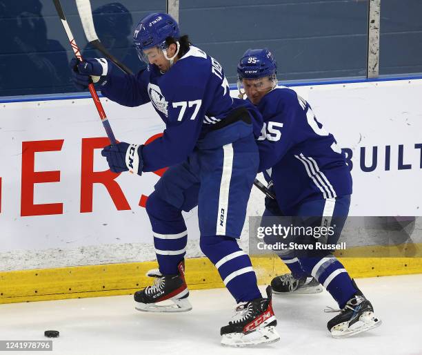 Ryan Tverberg battles Jeremy Wilmer as the Toronto Maple Leafs host 44 prospects at their rookie development camp at Ford Performance Centre in...