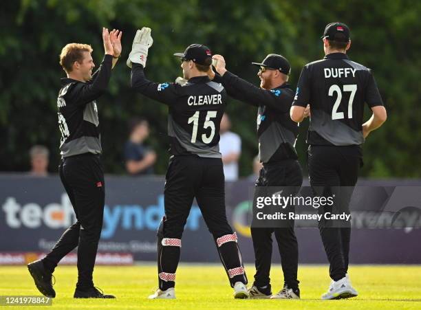 Belfast , United Kingdom - 18 July 2022; New Zealand players celebrate a wicket during the Men's T20 International match between Ireland and New...