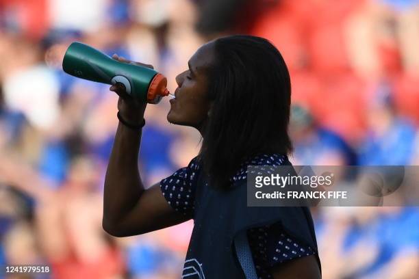 France's defender Wendie Renard drinks during the warming-up before the UEFA Women's Euro 2022 Group D football match between Iceland and France at...