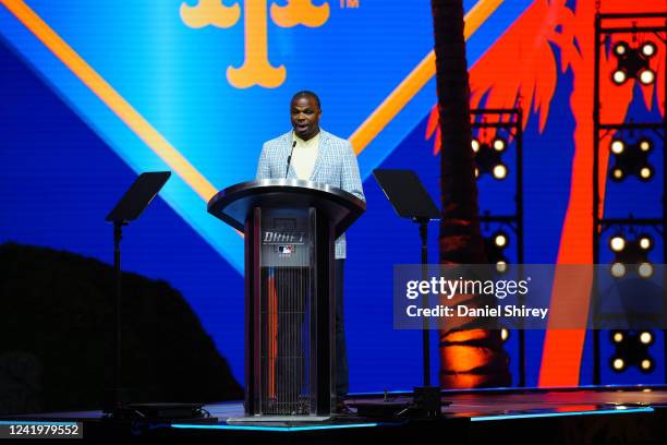 Club representative Rajai Davis announces a draft pick for the New York Mets during the 2022 Major League Baseball Draft at L.A. Live on Sunday, July...