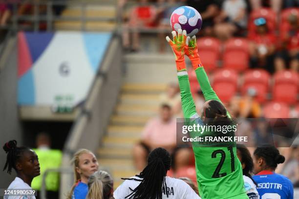 France's goalkeeper Pauline Peyraud-Magnin stretches to make a save during the UEFA Women's Euro 2022 Group D football match between Iceland and...