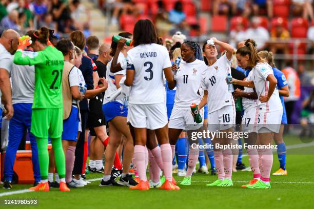 Clara MATEO of France refresh herself with a cool towel on a cooling break during the UEFA Women's European Championship Group Stage - Group D match...