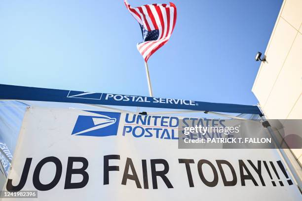 Job fair signage is displayed during a job fair hiring new postal workers and mail carrier assistants outside a United States Postal Service post...