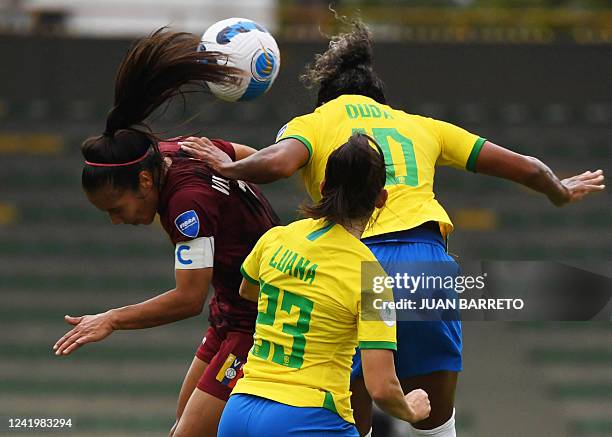 Venezuela's Paola Villamizar and Brazil's Duda jump for a header during their Conmebol 2022 women's Copa America football tournament match at the...