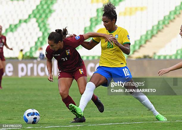 Venezuela's Barbara Olivieri and Brazil's Duda vie for the ball during their Conmebol 2022 women's Copa America football tournament match at the...