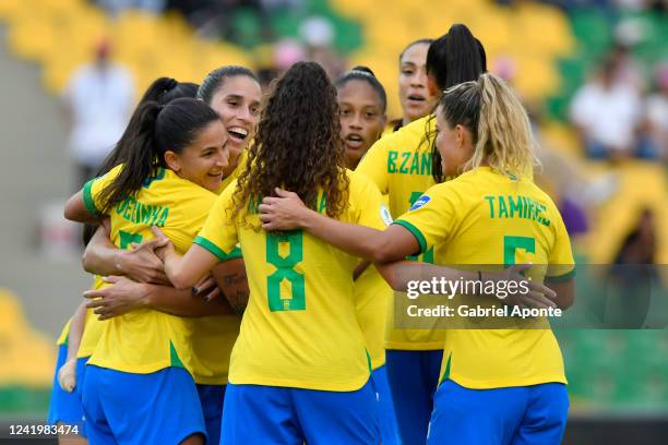 Debinha of Brazil celebrates with her teammates after scoring the third goal of her team during a match between Venezuela and Brazil as part of...