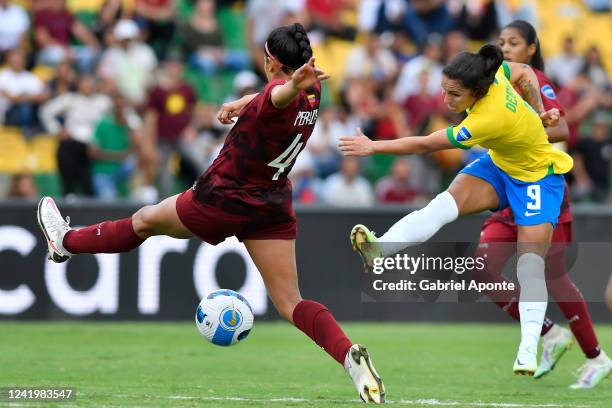 Maria Alejandra Peraza of Venezuela and Debinha of Brazil fight for the ball during a match between Venezuela and Brazil as part of Women's CONMEBOL...