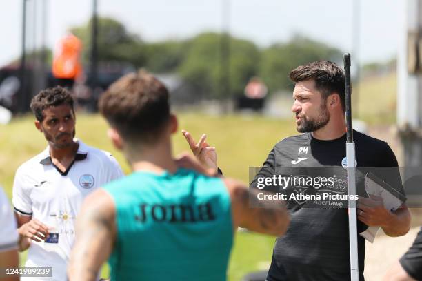 Manager Russell Martin of Swansea City speaks to his players during half time during the Pre-Season Friendly match between Swansea City and Bristol...