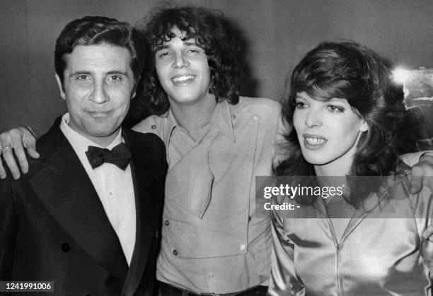 French singers Dani and Gilbert Becaud meet French singer Julien Clerc after his show at L'Olympia music hall in Paris on December 18, 1970.