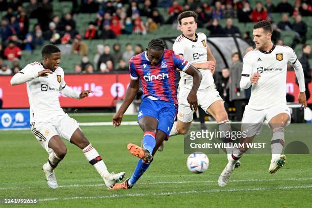 Crystal Palace player Jean-Philippe Mateta shoots on the Manchester United goal during the pre-season football match between English Premier League...