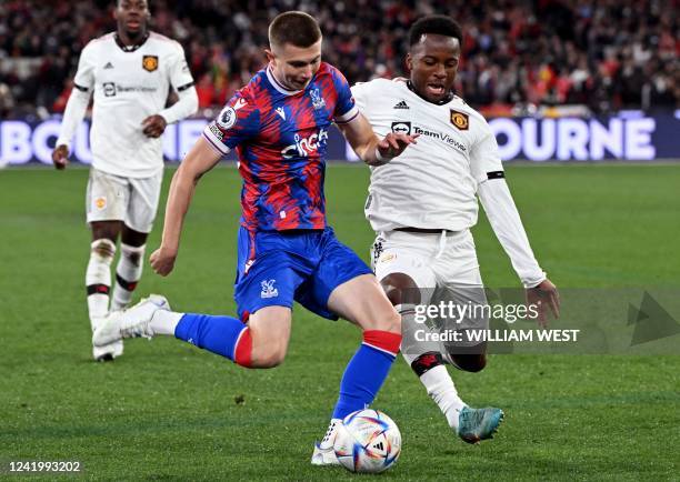 Crystal Palace player Scott Banks is tackled by Manchester United player Ethan Laird during the pre-season football match between English Premier...