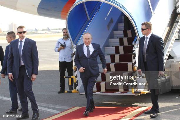 Russian President Vladimir Putin leaves his presidential plane during the welcoming ceremony at the airport, on July 19, 2022 in Tehran Iran. Russian...