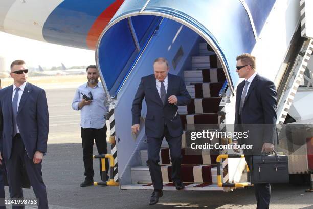 Russian President Vladimir Putin leaves his presidential plane during the welcoming ceremony at the airport, on July 19, 2022 in Tehran Iran. Russian...