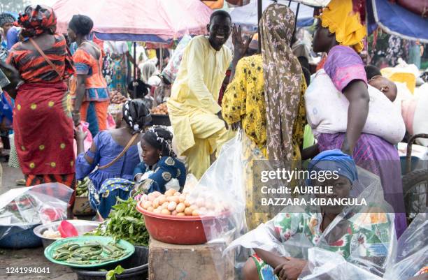 With a lack of structures, vendors set up their bags of goods and their fruit and vegetable stalls on the ground at the market in Dembe, a district...