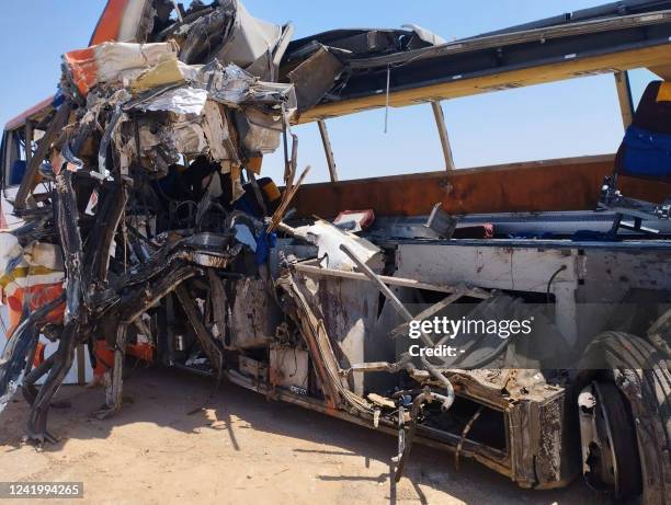 Picture shows the remains of a bus after it crashed into a truck on a road in al-Minya Governorate south of the the Egyptian capital on July 19,...