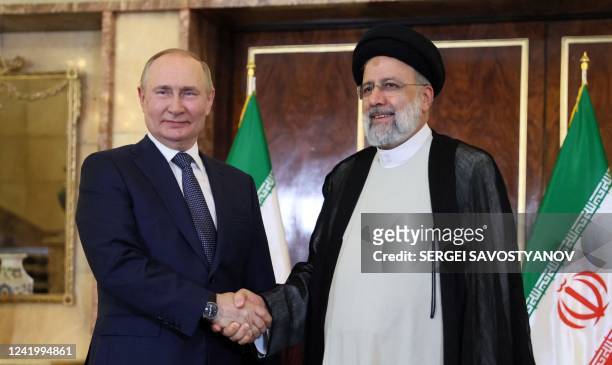 Russian President Vladimir Putin and Iran's President Ebrahim Raisi hold a meeting in Tehran on July 19, 2022. - Iran's president will host his...
