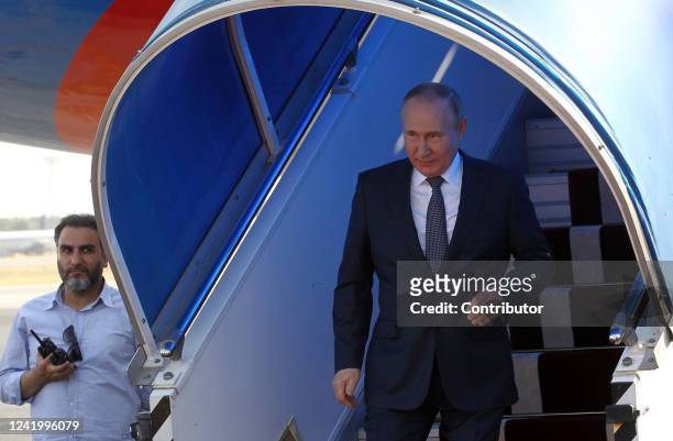 Russian President Vladimir Putin leaves his presidential plane during the welcoming ceremony at the airport on July 19, 2022 in Tehran, Iran. Russian...