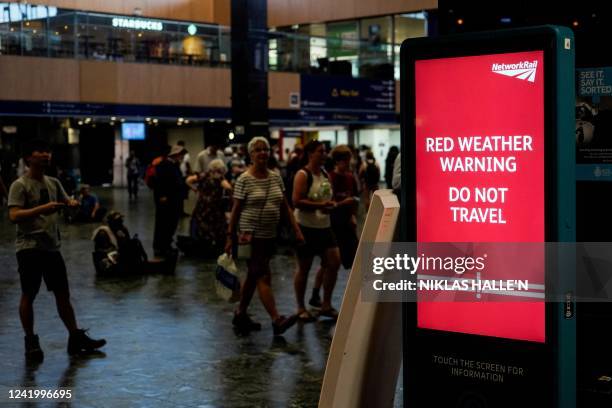 Board warning the Rail passengers about the high temperatures and its impact on the rail traffic is pictured at Euston train station in central...