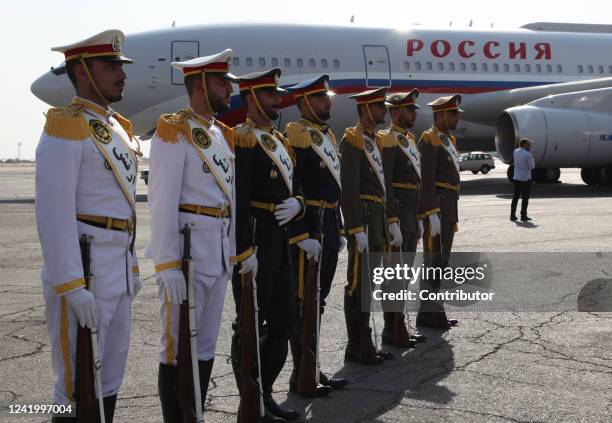 Iranian Honour Guards seen near the Russian Presidential Ilyushin IL-96 plane during the welcoming ceremony at the airport, July 19 in Tehran, Iran....