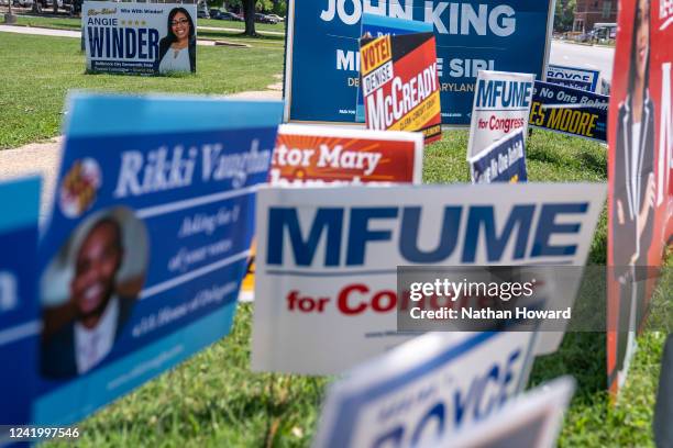 Campaign signs line the road near a polling place at The League for People with Disabilities during the midterm primary election on July 19, 2022 in...