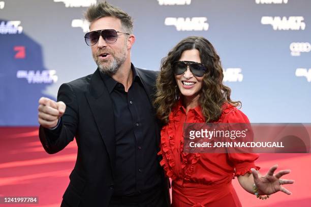 Director David Leitch and US Executive producer Kelly McCormick pose on the red carpet for a photo at a preview of the film Bullet Train at the Zoo...