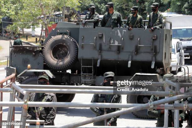 Sri Lanka Army with an armoured personnel carrier near iron barricades along the entrance road to the parliamentary complex at Sri Jayawardenepura...