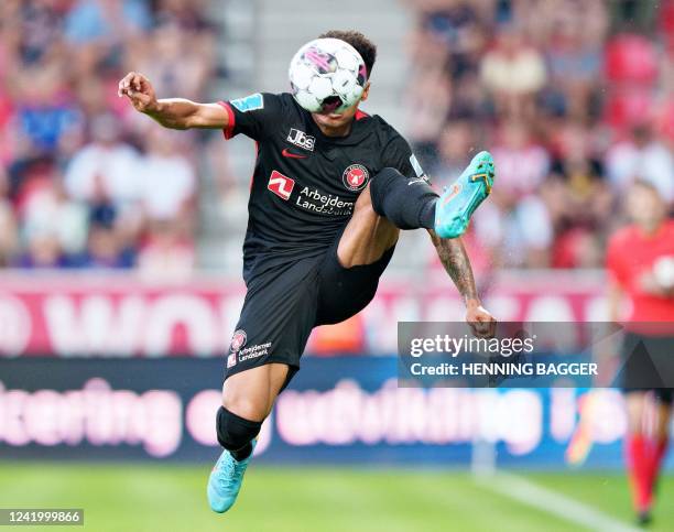 Midtjylland's Brazilian defender Paulinho jumps during the Champions League qualifying football match between Midtjylland and AEK Larnaca at the MCH...