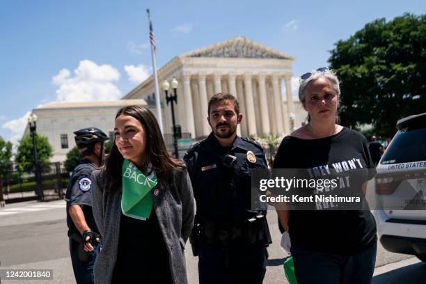 Rep. Alexandria Ocasio-Cortez is detained after outside the Supreme Court of the United States during a sit-in protesting the high court overturning...