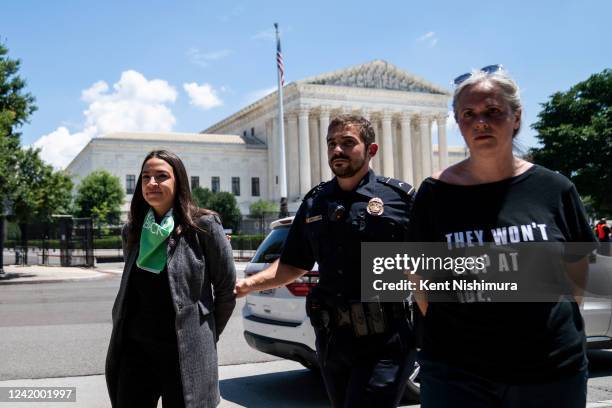 Rep. Alexandria Ocasio-Cortez is detained after outside the Supreme Court of the United States during a sit-in protesting the high court overturning...