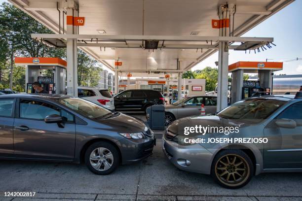 Cars sit at gas pumps at a Gulf gas station, which is selling regular gas at $4.09 a gallon, in Lynnfield, Massachusetts, on July 19, 2022. US...