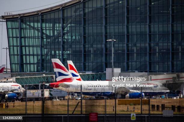 British Airways aircraft are prepared for take-off outside Terminal 5 at Heathrow Airport on the day on which the UK's hottest ever temperature of...