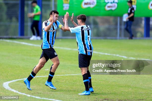 Arthur Viana of Gremio celebrates with teammate after scoring the goal of his team during the match between Gremio and Alianza Lima as part of the...