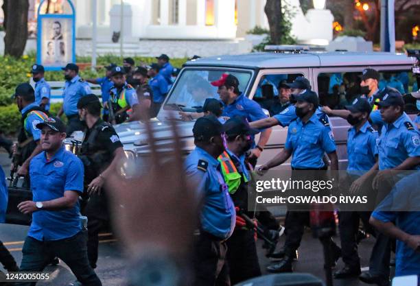 Nicaraguan President Daniel Ortega arrives on a vehicle surrounded by policemen, accompanied by his wife, Vice-President Rosario Murillo, for the...