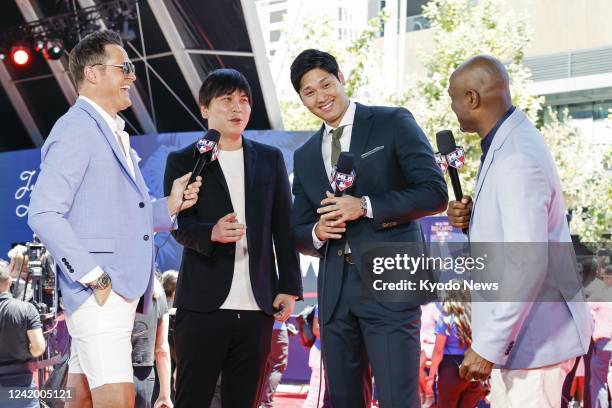 Los Angeles Angels two-way player Shohei Ohtani gives an interview during the Red Carpet Show before the MLB All-Star baseball game on July 19 at...