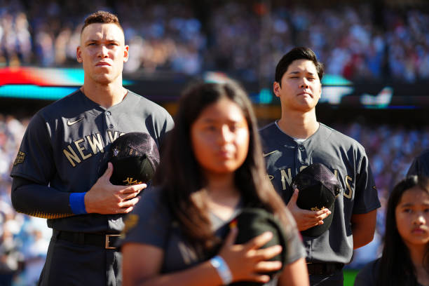 Aaron Judge of the New York Yankees looks on during the singing of the national anthem prior to the 92nd MLB All-Star Game presented by Mastercard at...
