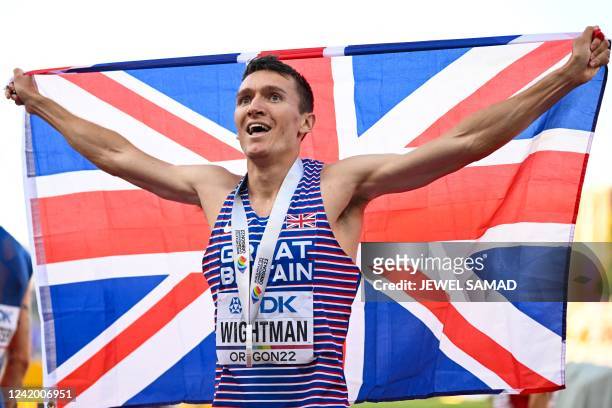 Britain's Jake Wightman celebrates with his medal after winning the men's 1500m final during the World Athletics Championships at Hayward Field in...